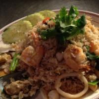 Seafood Fried Rice · Jasmine rice stir fried with calamari, shrimps, mussels, onions and tomatoes.