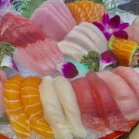 Sushi & Sashimi Platter For 2 · 10 pieces of sushi, 20 pieces of sashimi and a rainbow roll. These items may be served raw o...