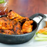 Campfire Wings · Mesquite-smoked wings and drumettes, dill ranch, carrot & celery sticks, choice of honey-gin...