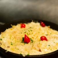 Artichoke Dip · House-made artichoke cheese dip with a garlic bread crumb crust, served with veggies, house ...