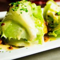Wagon Wedge Salad · Iceberg lettuce, crisp bacon, Black Cave blue cheese, heirloom cherry tomatoes, house-made c...