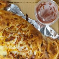 Meat Calzone · Canadian bacon, Italian sausage, Pepperoni, salami and pizza sauce.
