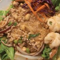 Yum Woon Sen · Warm glass noodle salad with prawns, ground pork, red onions, tomatoes, scallions, and peanu...