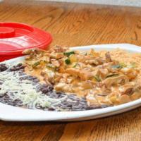 Creamy Chipotle Chicken · Chicken, mushrooms, zucchini and onions sauteed in a creamy chipotle sauce. Served with blac...