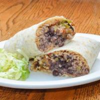 Special Breakfast Burrito · Large flour tortilla filled with black beans, rice, eggs, country fried potatoes, green bell...