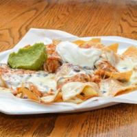 Nachos (Half Order) · Our homemade corn chips topped with black beans, red salsa, melted cheese, and topped with s...