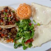 Pechuga Suiza Con Alambre #15 · Pechuga suiza and two Beef or chicken alambre tacos served with rice and charro beans.