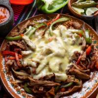 Alambre · Steak, bacon, green bell peppers, onions, and cheese served fajita style with a side of 4 co...