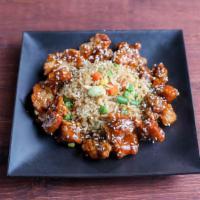 Orange Chicken Fried Rice · Rice, egg, and vegetables wok-seared in a soy-based sauce.