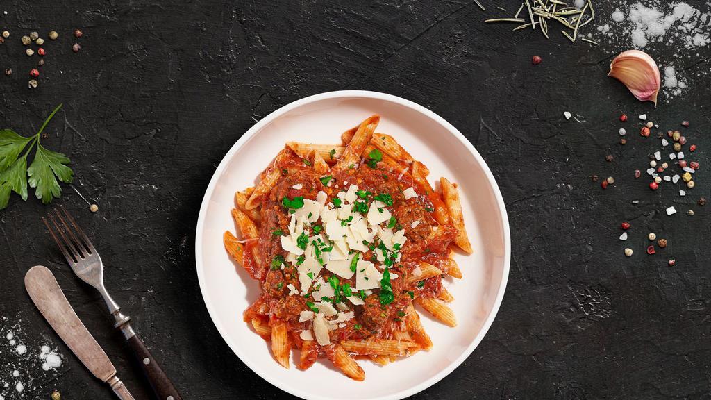Ballin' Bolognese Pasta · Fresh Cavatappi pasta cooked in a meaty red sauce and topped with black pepper, parsley, and parmesan.