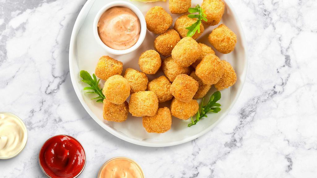 Tater Tots · (Vegetarian) Shredded Idaho potatoes formed into tots, battered, and fried until golden brown. Served with your choice of sauce.