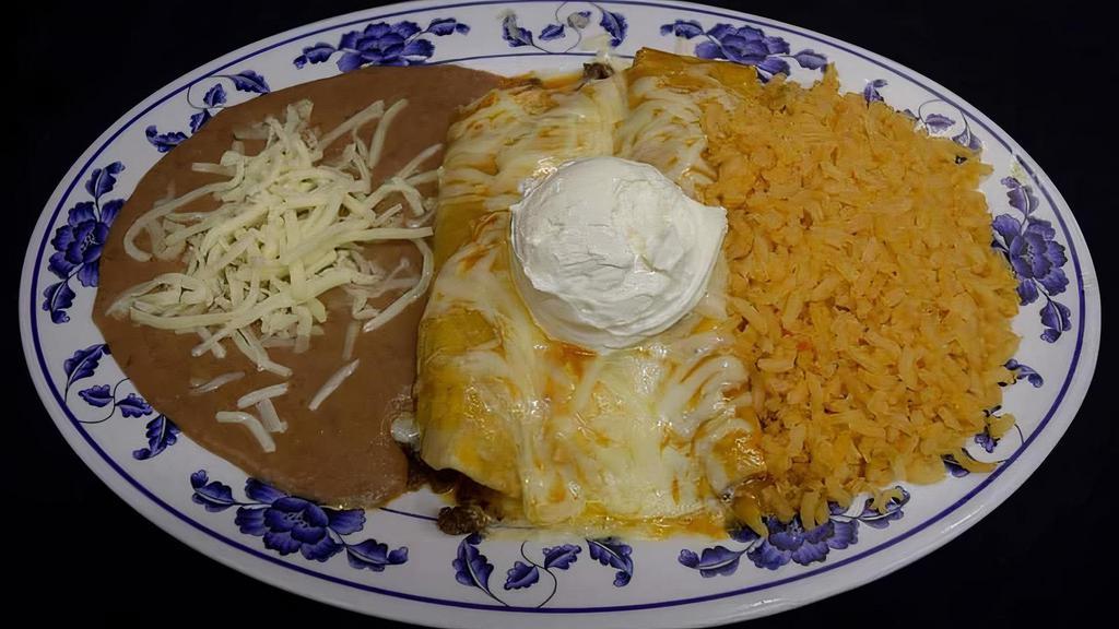 Combo Tamales Chicken  · 2 tamales with rice refried beans covered with sauce and cheese and cream