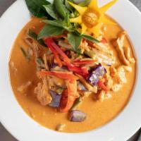 Red Curry · Red curry simmered in coconut milk, bamboo shoots, bell peppers, string beans, eggplant and ...