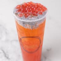 Passion In Love Tea Cocktail · Strawberry passion fruit oolong tea with strawberry pop and chia seeds.