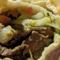 Carne Asada Burrito · Top sirloin steak, guacamole, Mexican salsa.