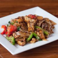 Pad Kee Mao · Spicy. Traditional Thai wide rice noodles wok-fried with garlic, fresh chili, egg, onion, to...