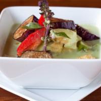 Green Curry · Spicy. Made from ground fresh Thai green chilies, coconut milk, and spices, simmered with eg...