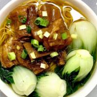 Beef Stew Noodle Soup牛腩湯面 · Stewed/braised beef,thin egg noodles and season green vegetables in chicken broth.