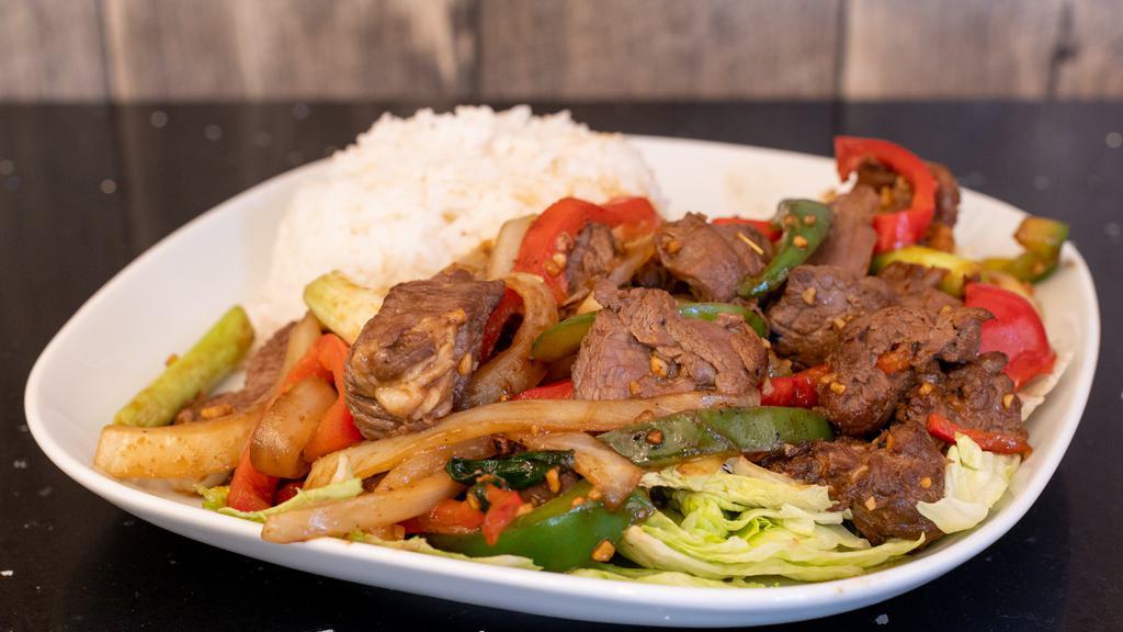 Shaking Beef · Sautéed steak cubes with cucumber, lettuce, onions and pepper.