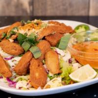 Vegan Chicken Salad With Basil · Fresh delicate salad of shredded cabbage, carrots, fried shallot, peanuts, lime juice and ba...