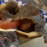 Gyro Sandwich · Warm pita bread topped with gyro meat, tomatoes and red onions.
