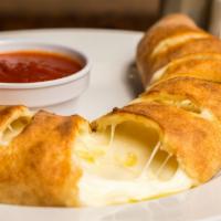 Stromboli · Ham, pepperoni and mozzarella cheese baked in our fresh dough and served with a side of mari...