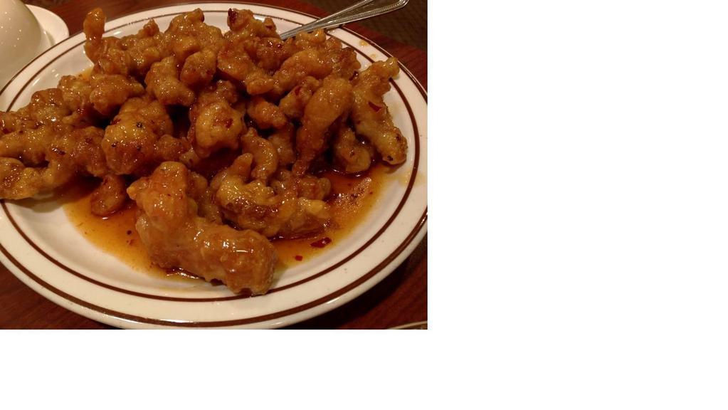 Orange Chicken · Spicy. Seared red chilies and grated orange peels with crispy chicken in an orange sauce.