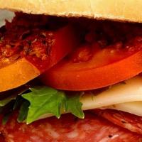(T) Classic Cold-Cut Italian Sub · Genoa salami, capocolla, ham, provolone, lettuce, tomato and onion on a hoagie roll.