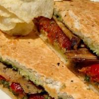 (T) Grilled Eggplant & Roasted Bell Pepper Panino · VEGAN. Grilled eggplant, marinated roasted red bell peppers, and vegan macadamia nut pesto s...
