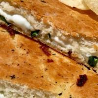 (T) Fresh Mozzarella & Basil Panino · Mozzarella and fresh basil on toasted focaccia bread.