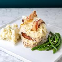 Bacon And Swiss Stuffed Chicken Breast · With cheese sauce, mashed potatoes and vegetables.