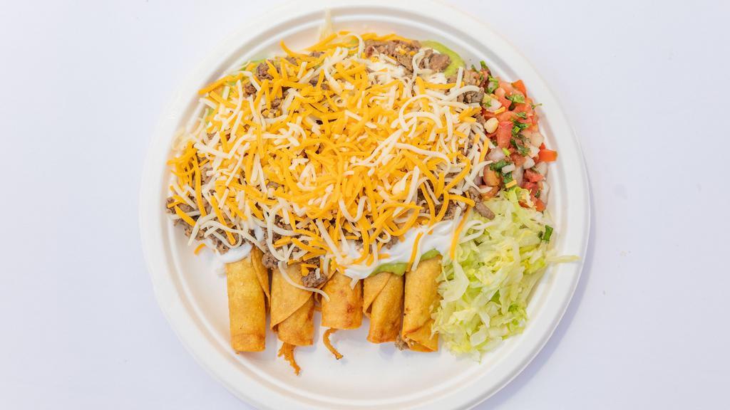 5 Rolled Tacos Supreme · 5 rolled hard shell tacos filled with shredded beef, or chicken, or potato, topped with guacamole, sour cream, pico de gallo lettuce, cheese and carne asada.