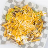 Carne Asada Fries · French fries topped with  carne asada, guacamole sour cream, and cheese.