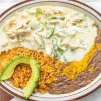 Pollo Con Crema · Tender chicken strips cooked in an authentic Mexican sour cream sauce with onions and bell p...