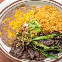 Carne Asada · Skirt steak butter flied and flame broiled to your liking. Served with your choice of warm t...