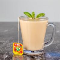 Milk Tea · Powdered milk tea with cardamom and mint.