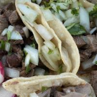 Tacos · Choice of meat, onions, cilantro, tortilla.