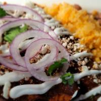 Large Flour Enchilada · A flour tortilla rolled with shredded (white meat) chicken. Topped with Oaxacan mole sauce, ...