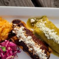 Tamale Plate · Two steaming tamales served with rice and salad. Topped with queso fresco, jalapeños. and sa...