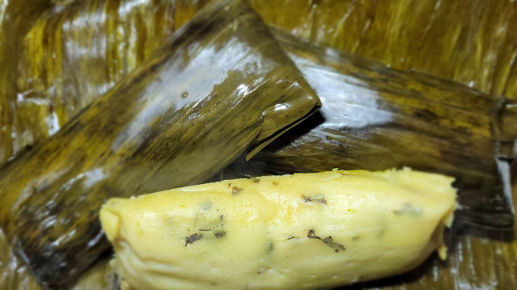 Oaxaqueno  Tamales · shredded chicken, green tomatillo sauce ,steam with banana leaf.