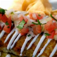 Al Pastor Burrito (Marinate Pork) · pineapple marinate pork.Topped with chile  verde sauce, melted cheese,sour cream,pico,and ch...