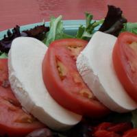 Caprese Salad · Mozzarella, spring mix, tomato, black kalamata olives, roasted red peppers, olive oil, balsa...