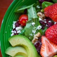 Strawberry Walnut Salad · Spring mix, feta cheese, cherry tomato, walnuts, avocado, fresh strawberries, dried cranberr...
