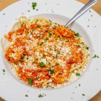 Shrimp And Feta Cheese* · Large shrimp baked in a fresh tomato, onion, and garlic sauce. Served over rice or spaghetti...