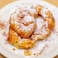 Bougatsa · Fillo pastry with creamy custard filling. Sprinkled with powdered sugar and cinnamon.