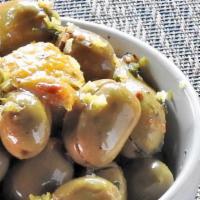 Olives Al Forno · Oven roasted mediterranean olives, extra virgin olive oil, roasted garlic.