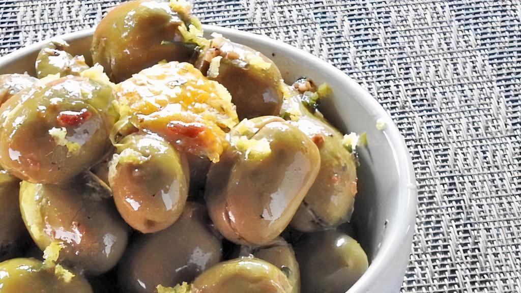 Olives Al Forno · Oven roasted mediterranean olives, extra virgin olive oil, roasted garlic.