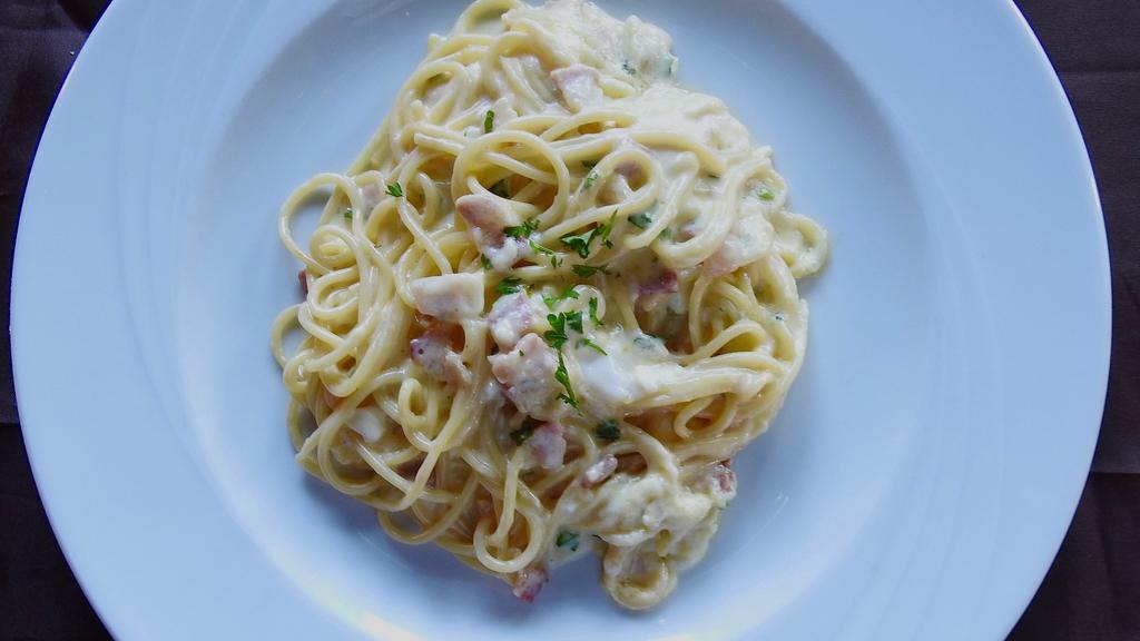Spaghetti Carbonara · Reggiano parmigiano, eggs, garlic cream, pancetta.