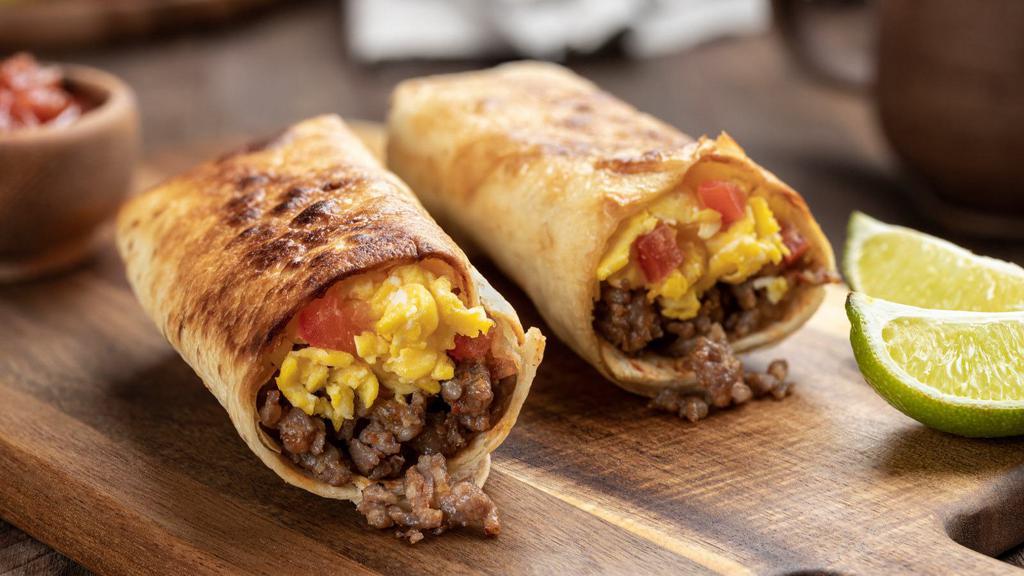Big Sausage Breakfast Burrito · Fluffy scrambled eggs, melty shredded Cheddar cheese, savory breakfast sausage and skillet browned breakfast potatoes wrapped in a large, soft, flour tortilla.