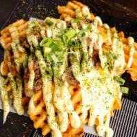 Beef Bulgogi Fries · Korean style BBQ beef, thinly sliced over waffle cut potato fries with cheese, wasabi mayo, ...